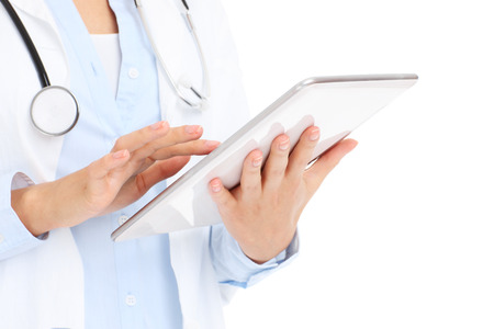 A picture of a doctor holding tablet over white backgroundの写真素材