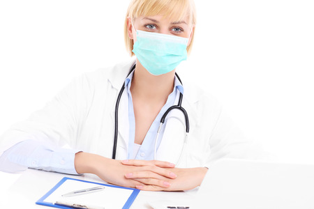 A picture of doctor doing paperwork over white backgroundの写真素材