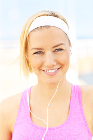 Portrait of fit young woman on the pierの写真素材