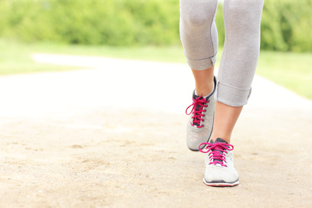 A picture of jogger's legs on the path in the parkの写真素材