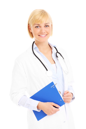 A picture of a young doctor standing with documents over white backgroundの写真素材