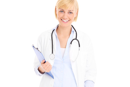 A picture of a young doctor standing with documents over white backgroundの写真素材
