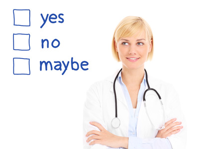 A picture of a young doctor looking over white background and trying to take decisionの写真素材
