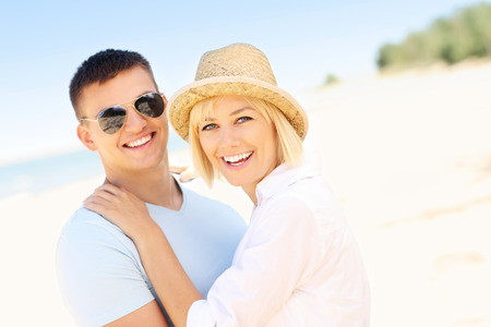 A picture of a joyful couple having fun at the beachの写真素材