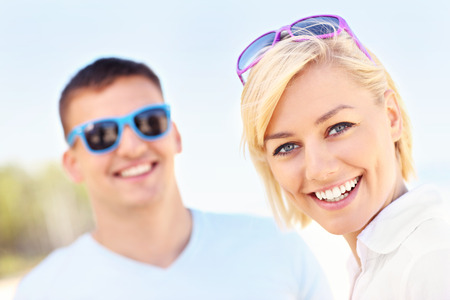 A picture of a woman spending time with her boyfriend at the beachの写真素材