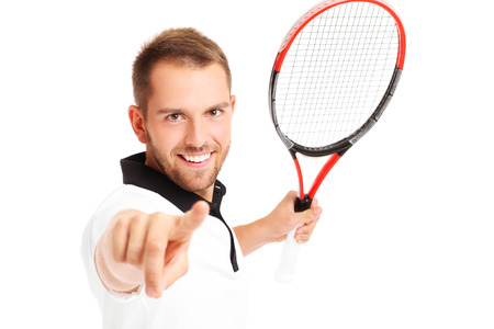 A picture of a tennis player pointing to the camera over white backgroundの写真素材