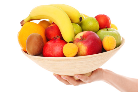 A picture of a bowl of fruits over white backgroundの写真素材