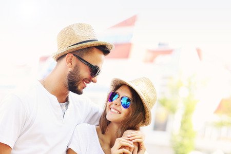 A picture of a young couple walking around the cityの写真素材