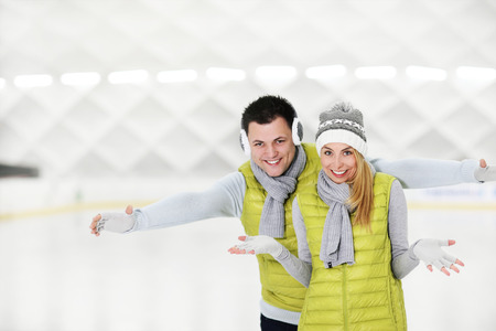 A picture of a happy couple in the ice rinkの写真素材