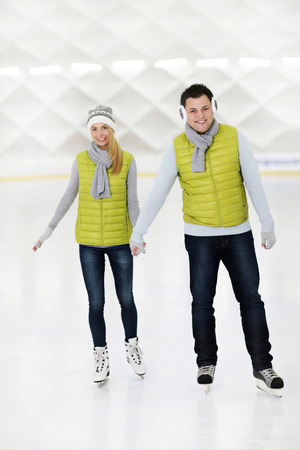 A picture of a happy couple in the ice rinkの写真素材