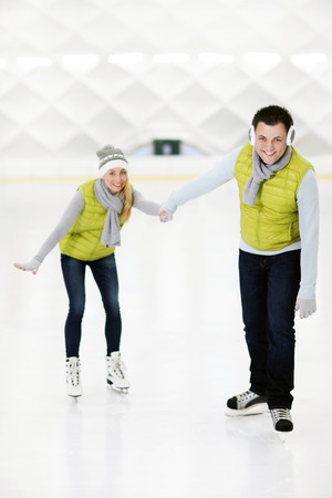 A picture of a happy couple in the ice rinkの写真素材