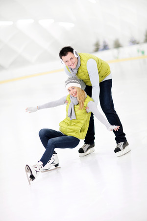 A picture of a happy couple in the ice rinkの写真素材