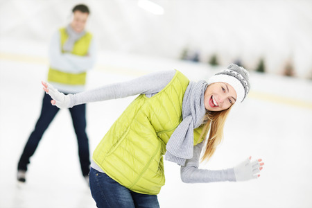 A picture of a happy couple in the ice rinkの写真素材