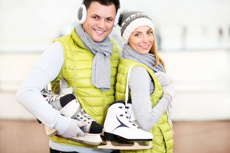 A picture of a happy couple in the ice rinkの写真素材