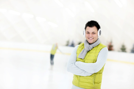 A picture of a happy man on the ice rinkの写真素材
