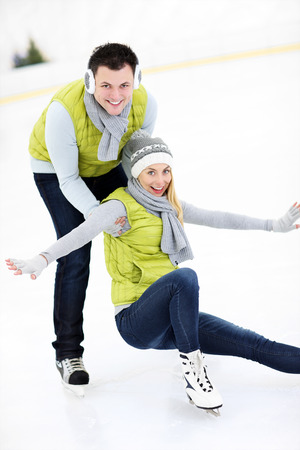 A picture of a happy woman on the ice rinkの写真素材