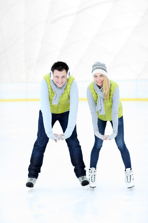 A picture of a happy woman on the ice rinkの写真素材