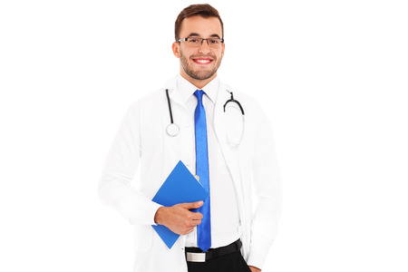 A portrait of a confident young doctor holding a file over white backgroundの写真素材