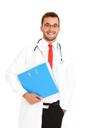 A portrait of a confident young doctor holding a file over white backgroundの写真素材