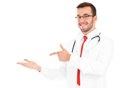 A picture of a happy doctor with stethoscope pointing at your productの写真素材