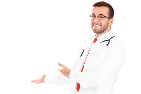 A picture of a happy doctor with stethoscope showing your product over white backgroundの写真素材