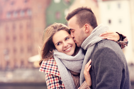 A picture of a man kissing a woman on a date in Gdanskの写真素材