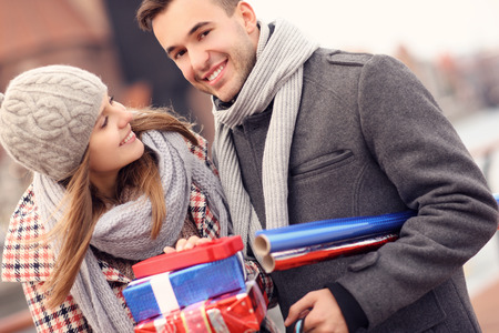 A picture of a beautiful couple on Christmas shoppingの写真素材