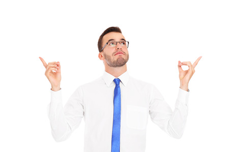 A picture of a young man pointing at something over white backgroundの写真素材