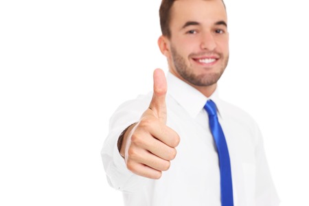 A picture of a young confident businessman showing ok sign over white backgroundの写真素材