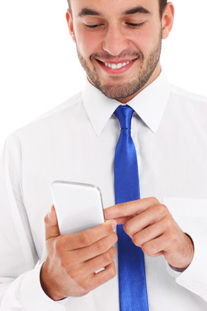A picture of a successful businessman using smartphone over white backgroundの写真素材