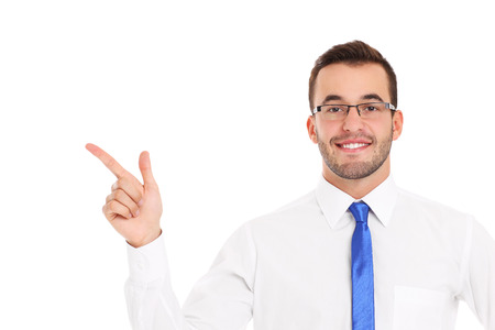 A picture of a happy businessman pointing over white backgroundの写真素材