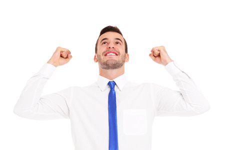 A picture of a successful businessman cheering over white backgroundの写真素材