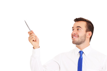 A picture of a happy businessman pointing over white backgroundの写真素材