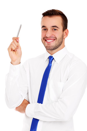 A picture of a successful businessman posing with a pen over white backgroundの写真素材