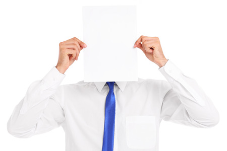 A picture of a businessman covering his face with a paperの写真素材