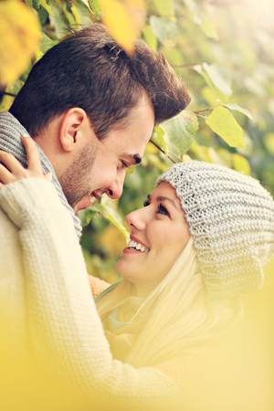 A picture of a young romantic couple in the park in autumnの写真素材