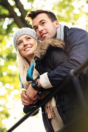 A picture of a young romantic couple in the park in autumnの写真素材