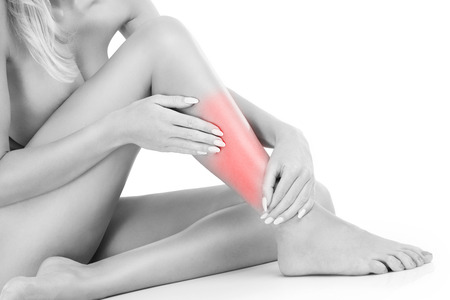 A picture of calf pain over white backgroundの写真素材
