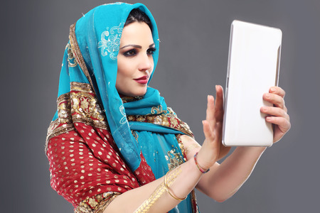 Portrait of oriental woman using tabletの写真素材