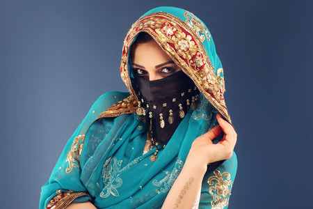 Portrait of beautiful mysterious oriental womanの写真素材