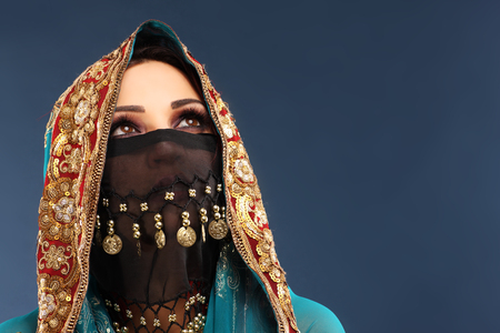 Portrait of beautiful mysterious oriental womanの写真素材