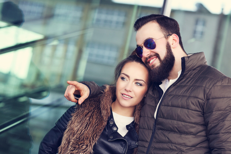 Picture of young couple hanging out and pointingの写真素材
