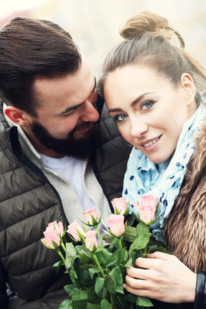 Picture of romantic couple on date with flowersの写真素材