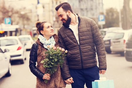 Picture of romantic couple on date with flowersの写真素材