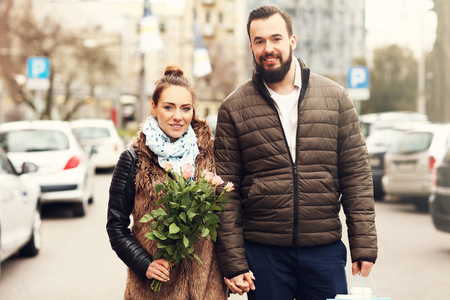 Picture of romantic couple on date with flowersの写真素材