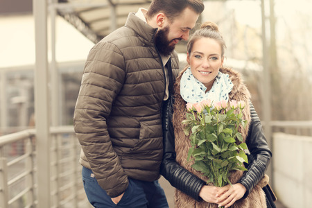 Picture of romantic couple on date with flowersの写真素材