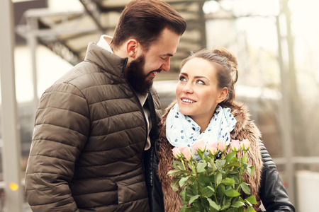 Picture of romantic couple on date with flowersの写真素材