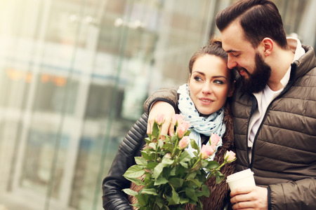 Picture of romantic couple on date with flowersの写真素材