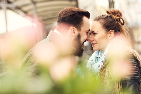 Picture of romantic couple on date with flowersの写真素材