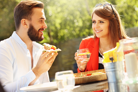 Picture of young couple in restaurantの写真素材